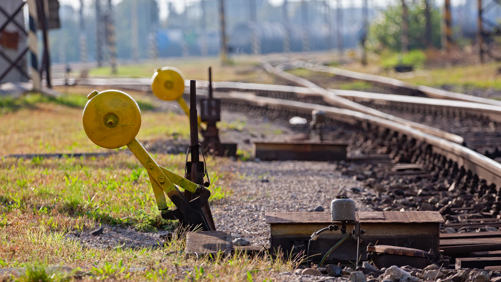 Track switches beside a railway line, the mechanism that decides which work goes down which line and in what order — which is the job described here