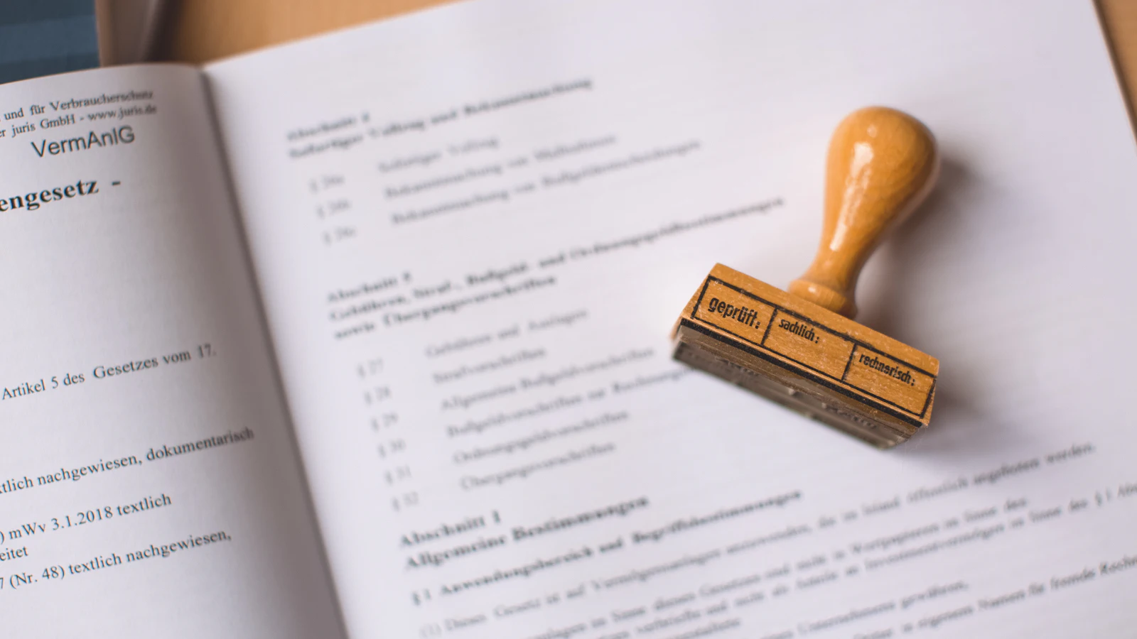 A wooden rubber stamp resting on a legal document: the moment a person takes responsibility for a decision, which is what ownership means in this post